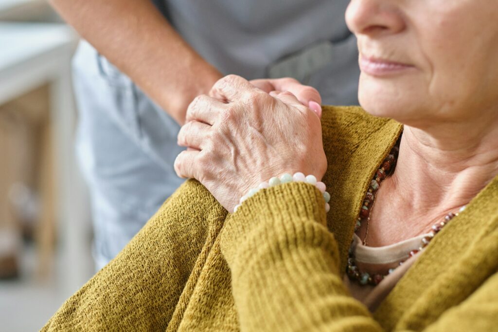 Nurse supporting the elderly woman